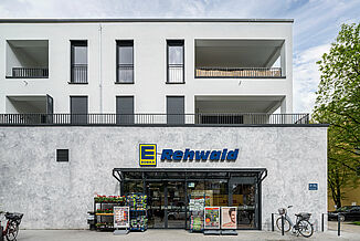 Edeka supermarket in a new building in Munich with flats above.