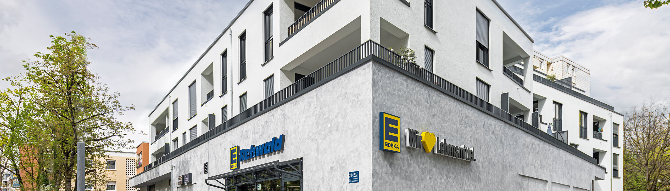 Mixed-use building with an Edeka supermarket on the ground floor on Renata Strasse in Munich.